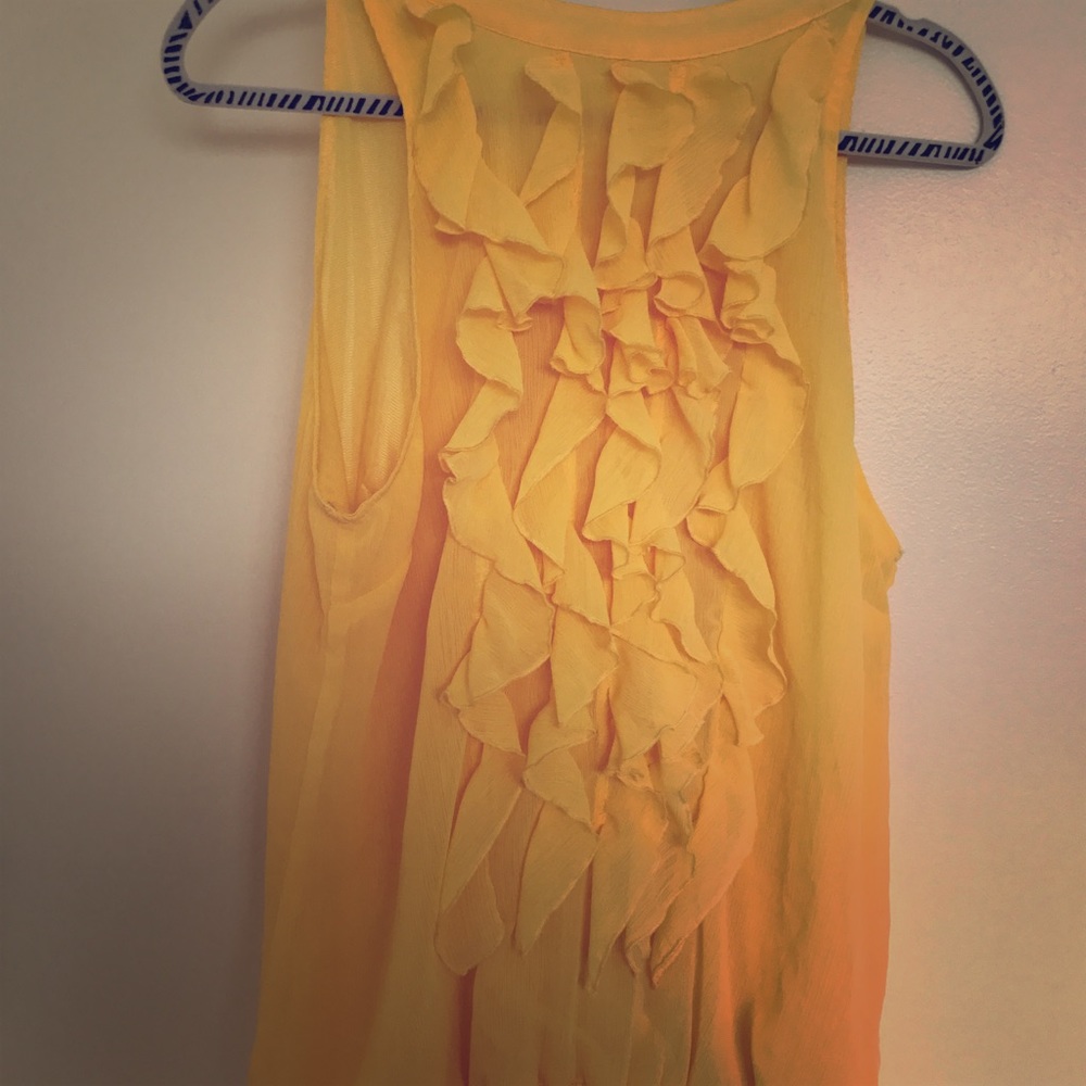 Yellow ruffled blouse